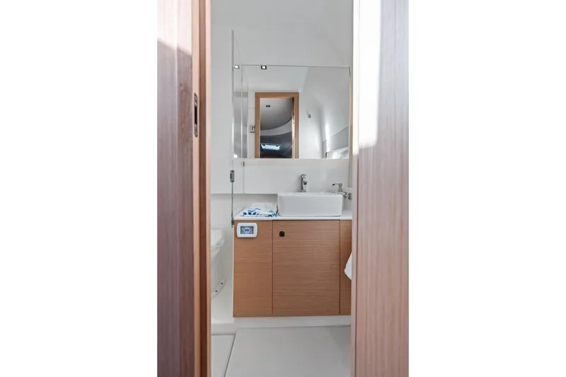 Slide: The Image of Modern bathroom interior in 2025 Makai M37, featuring sleek design and wooden cabinetry. - 55