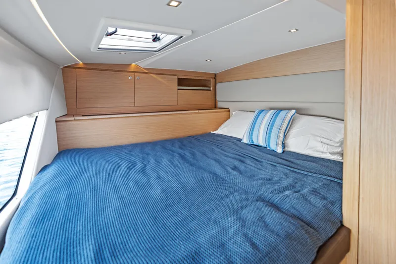 Slide: The Image of Luxurious cabin interior of 2025 Makai M37 yacht with cozy bed and skylight. - 63