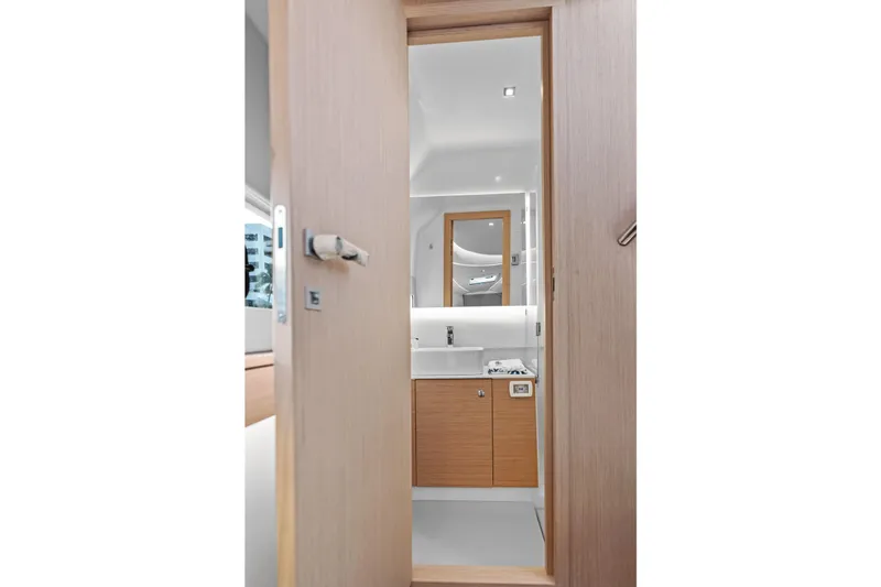 Slide: The Image of Modern bathroom interior on Makai M37 yacht, 2025 model, featuring sleek wood and white design. - 68