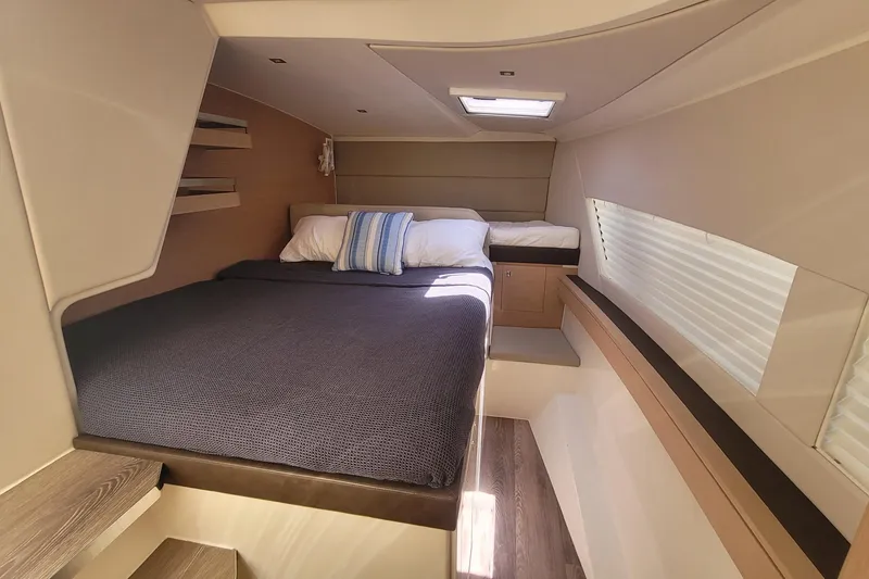 Slide: The Image of Luxurious cabin interior of 2025 Makai M37 yacht with cozy bedding and modern design. - 7