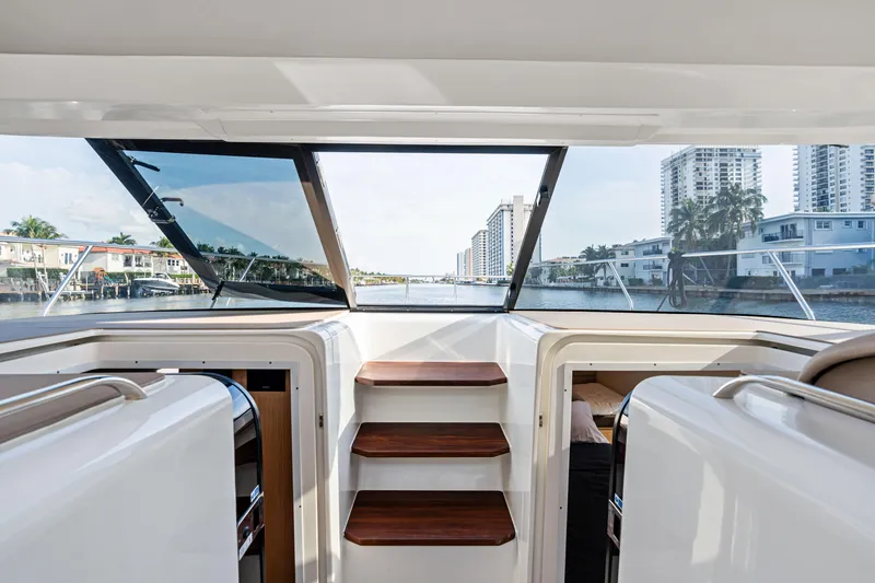 Slide: The Image of Interior view of 2025 Makai M37 yacht with cityscape through windows. - 72