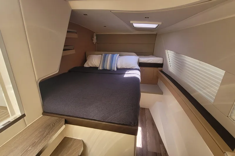 Slide: The Image of Luxurious cabin interior of 2025 Makai M37 yacht with cozy bedding and modern design. - 76