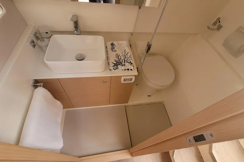 Slide: The Image of Modern bathroom interior in 2025 Makai M37, featuring sleek sink and compact design. - 8