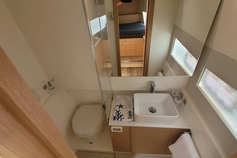 Slide: The Image of Modern bathroom in 2025 Makai M37 yacht with sink, toilet, and mirror. - 81