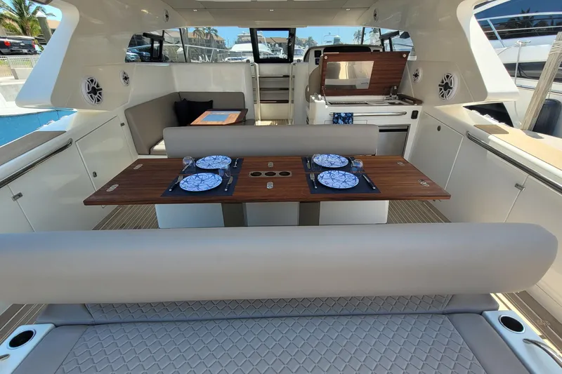 Slide: The Image of Luxurious 2025 Makai M37 yacht interior with elegant dining setup and modern amenities. - 88