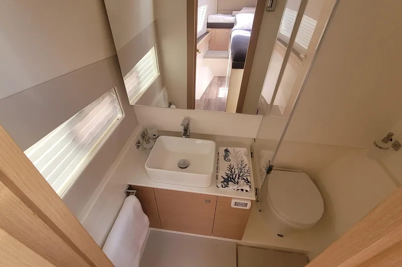 Slide: The Image of Modern bathroom interior in 2025 Makai M37 yacht, featuring sleek sink and toilet design. - 9