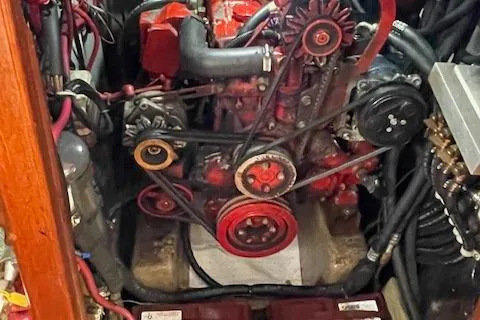 Slide: The Image of Engine compartment of a 1985 Shannon 43 Ketch sailboat, showcasing mechanical components. - 10