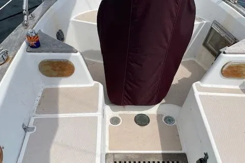 Slide: The Image of 1985 Shannon 43 Ketch cockpit with covered helm and drink can on seat. - 12