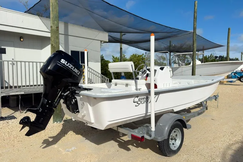 Slide: The Image of 2026 Coastal Skiff 171 boat with Suzuki outboard motor on a trailer. - 3