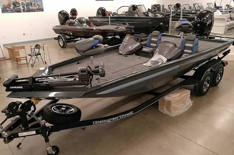 The Image of 2026 Ranger RT198P Fishing Package boat displayed in showroom, featuring advanced equipment. - 1