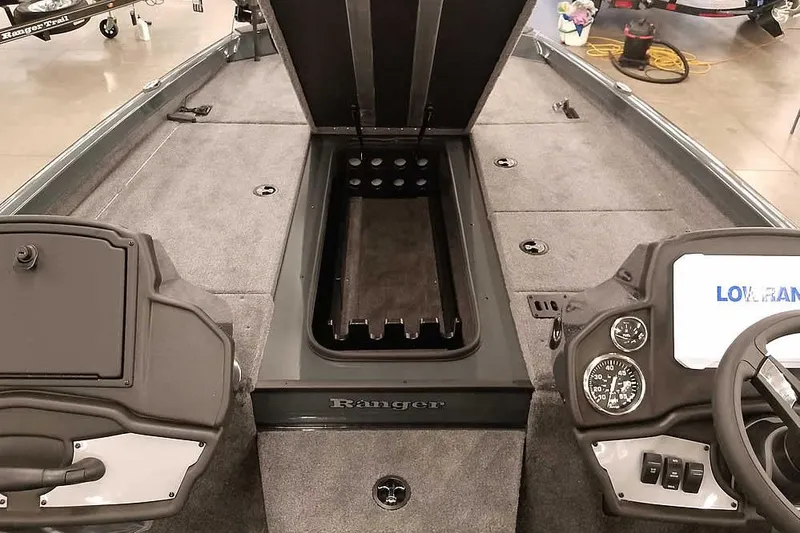Slide: The Image of 2026 Ranger RT198P Fishing Package interior with open storage compartment and control panel. - 13