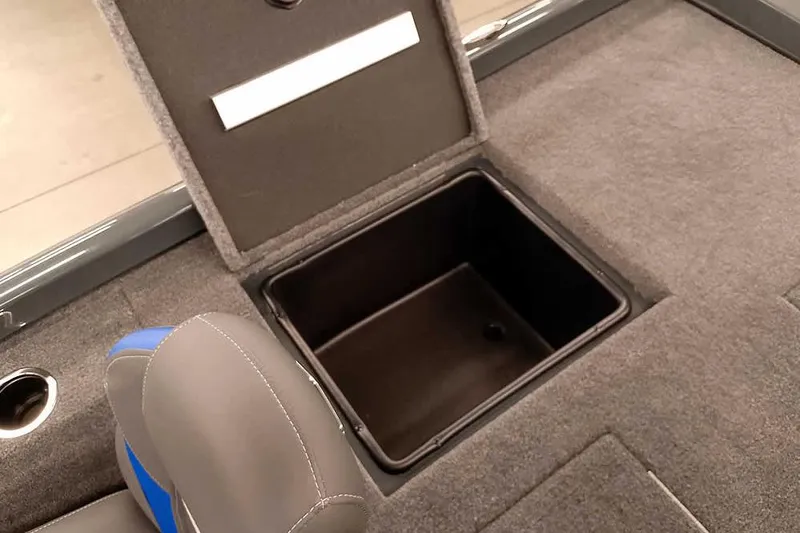Slide: The Image of 2026 Ranger RT198P Fishing Package storage compartment with open lid and seating detail. - 29