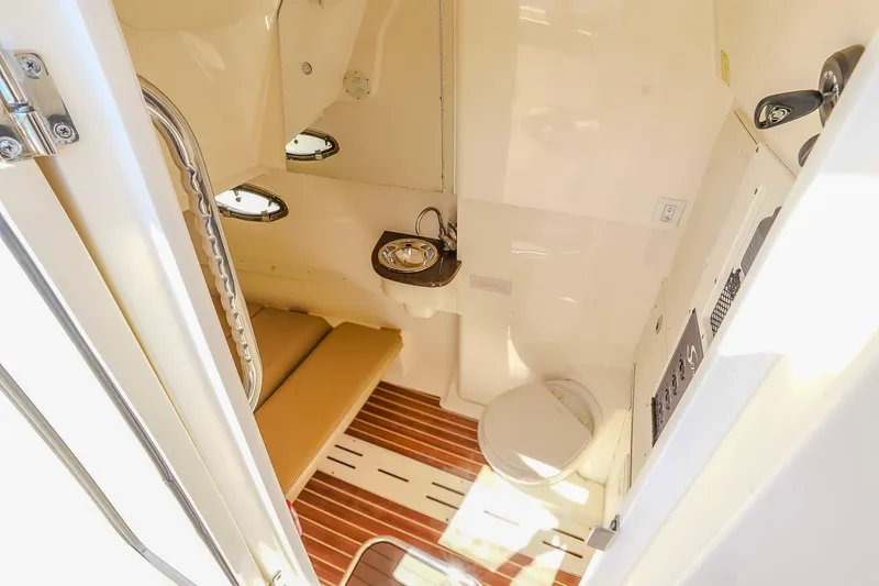 Slide: The Image of 2017 Scout 300 LXF cabin interior with seating, sink, and toilet. - 30