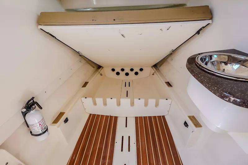 Slide: The Image of 2017 Scout 300 LXF cabin interior with wooden flooring and compact sink. - 32