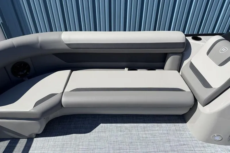 Slide: The Image of 2026 Premier 220 SUNSCAPE RL boat interior with sleek gray seating and modern design. - 11