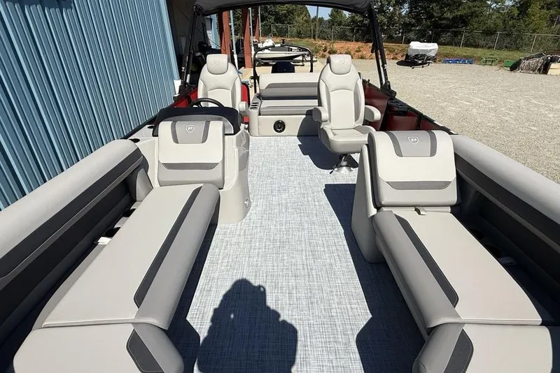 Slide: The Image of 2026 Premier 220 SUNSCAPE RL pontoon boat with spacious seating and modern design. - 21