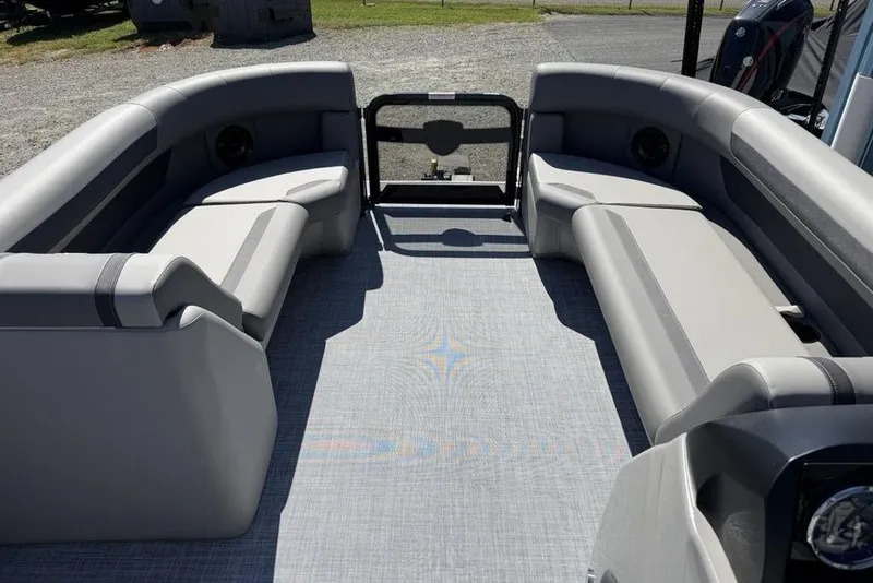 Slide: The Image of 2026 Premier 220 SUNSCAPE RL pontoon boat interior with gray seating and flooring. - 3