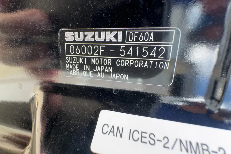 Slide: The Image of Suzuki DF60A engine label on a 2026 Coastal Skiff 171, made in Japan. - 13
