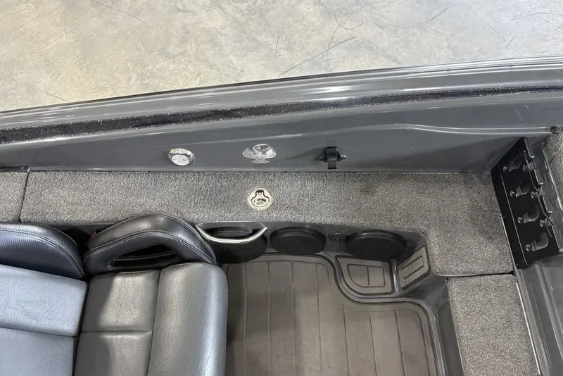 Slide: The Image of 2024 Phoenix 919 Pro XP interior with black leather seats and cup holders. - 16