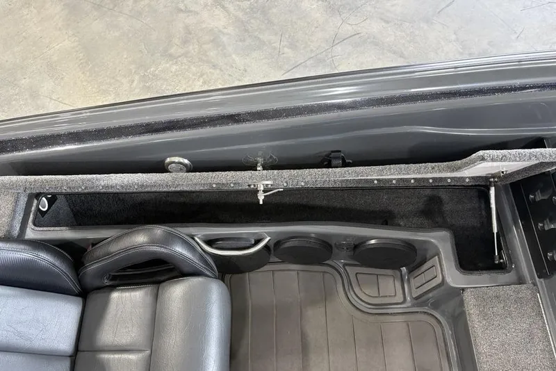 Slide: The Image of Interior view of 2024 Phoenix 919 Pro XP boat, featuring seating and storage compartments. - 20