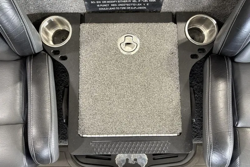 Slide: The Image of Interior of 2024 Phoenix 919 Pro XP with cup holders and carpeted center console. - 22