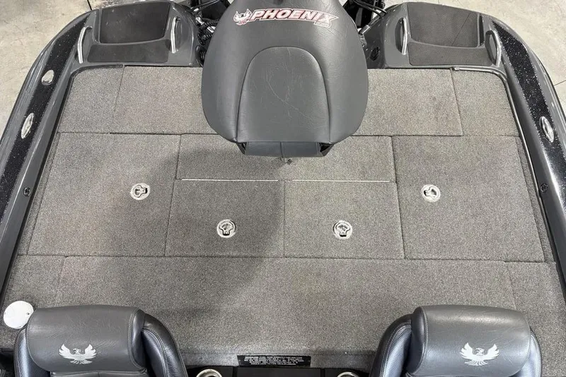 Slide: The Image of 2024 Phoenix 919 Pro XP boat deck with seating and storage compartments. - 28