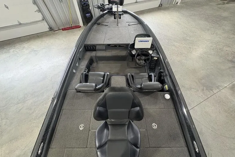 Slide: The Image of 2024 Phoenix 919 Pro XP boat interior with steering console and seating. - 32