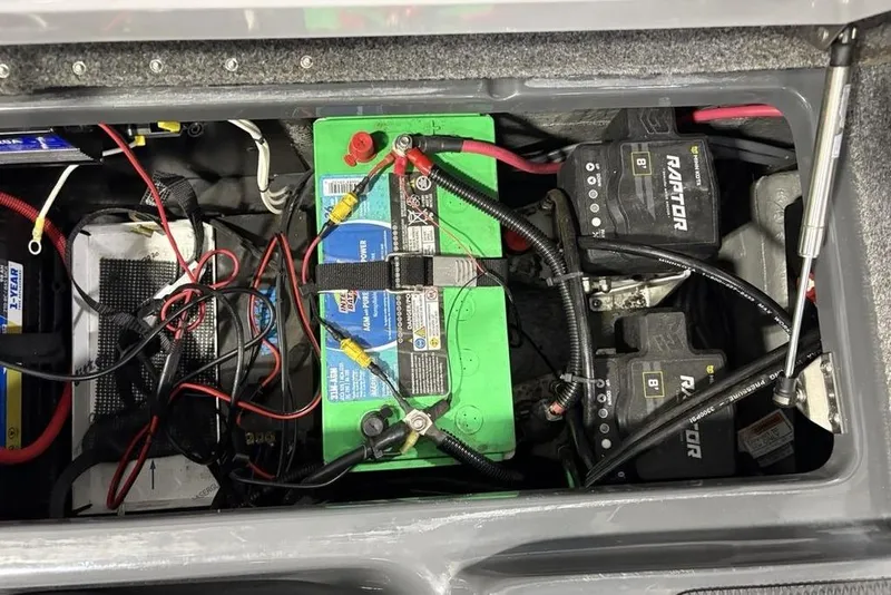 Slide: The Image of Battery compartment of 2024 Phoenix 919 Pro XP with wiring and Raptor components. - 34