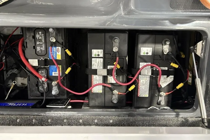 Slide: The Image of 2024 Phoenix 919 Pro XP battery compartment with multiple connected batteries and wiring. - 35