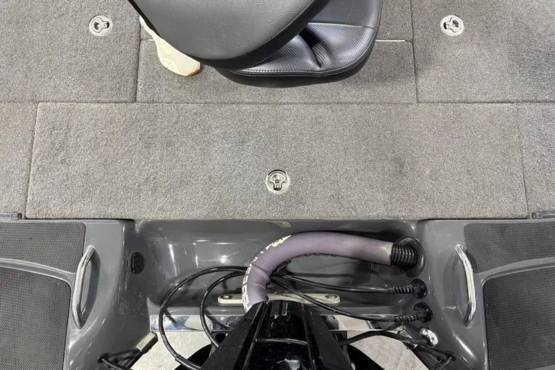 Slide: The Image of 2024 Phoenix 919 Pro XP boat interior with gray carpet and seat. - 36