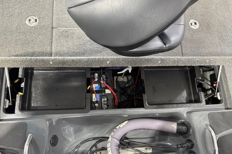 Slide: The Image of 2024 Phoenix 919 Pro XP boat interior showing battery compartment and seating area. - 37