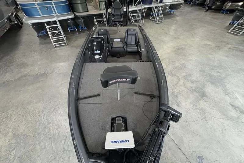Slide: The Image of 2024 Phoenix 919 Pro XP fishing boat interior with seating and equipment in showroom. - 39