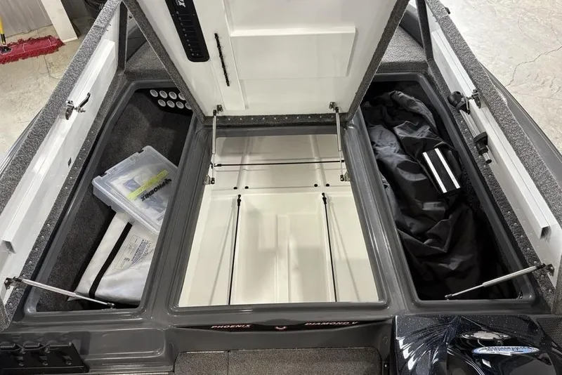 Slide: The Image of 2024 Phoenix 919 Pro XP boat storage compartments with organized gear and accessories. - 6