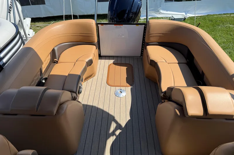 Slide: The Image of Luxurious interior of 2025 SunCatcher Fusion 324RC pontoon boat with tan seating. - 6