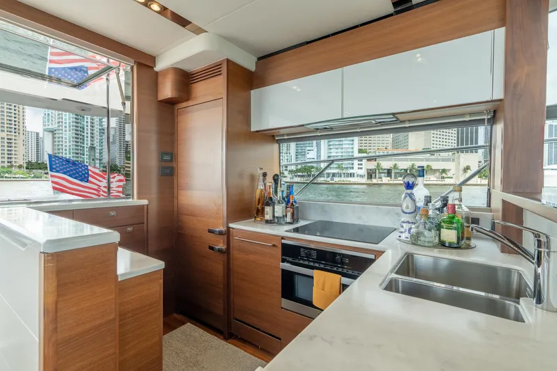 Slide: The Image of Luxurious kitchen interior of 2019 Princess F70 yacht with modern amenities and cityscape view. - 15