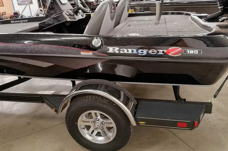 Slide: The Image of 2025 Ranger Z185 Z Pack boat on trailer, black exterior, sleek design. - 10