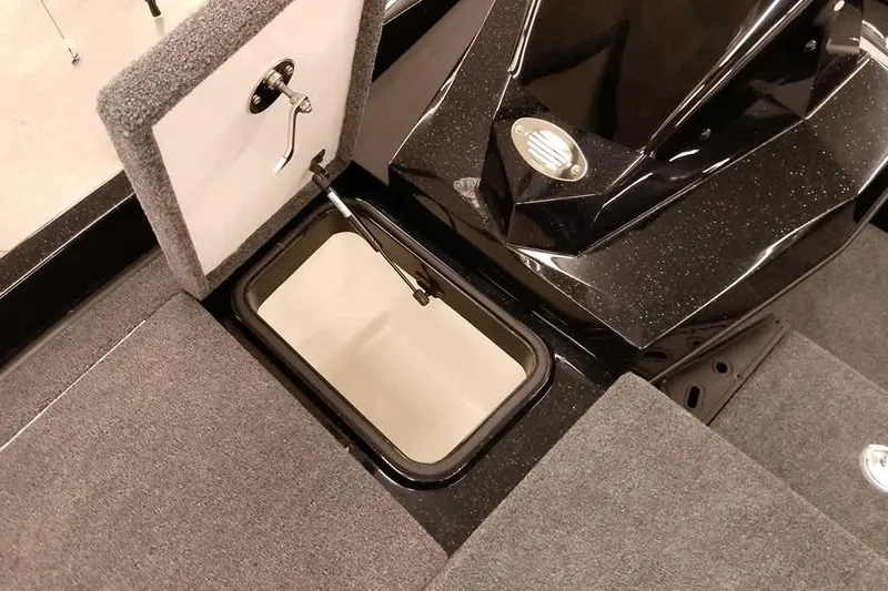 Slide: The Image of 2025 Ranger Z185 Z Pack boat storage compartment with carpeted lid and hydraulic lift. - 15