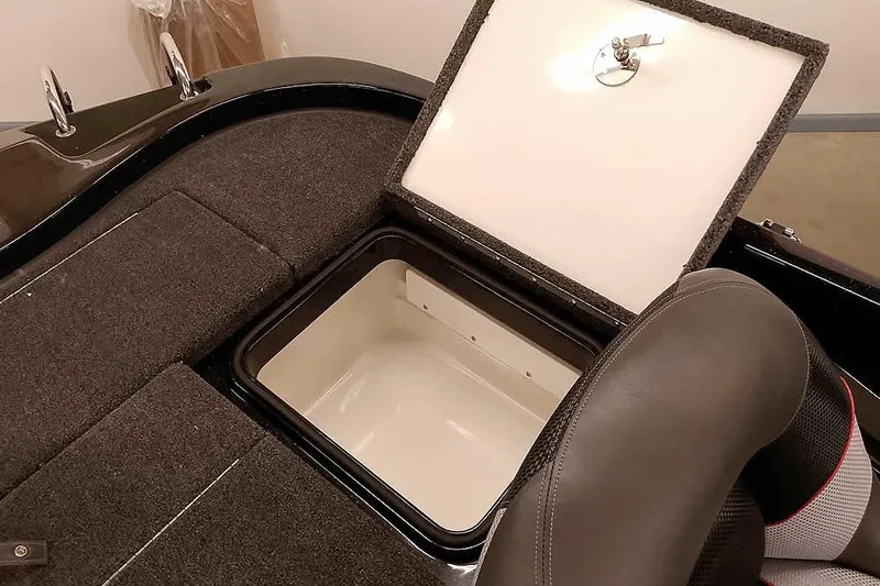 Slide: The Image of 2025 Ranger Z185 Z Pack boat storage compartment with open lid and seating. - 27
