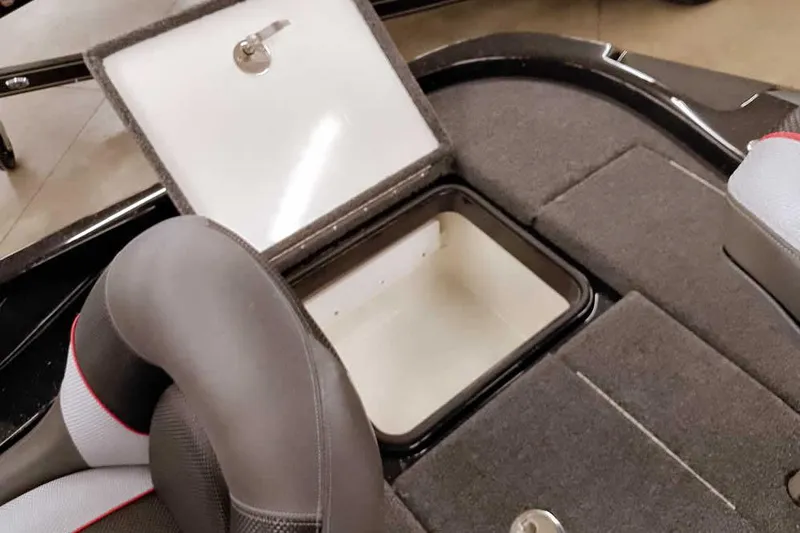 Slide: The Image of 2025 Ranger Z185 Z Pack boat storage compartment with open lid and seating. - 28