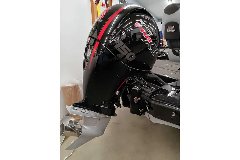 Slide: The Image of 2025 Ranger Z185 Z Pack boat with Mercury Pro XS 150 engine in showroom. - 3