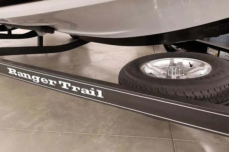 Slide: The Image of Trailer of 2025 Ranger Z185 Z Pack Equipped boat with visible tire and branding. - 5