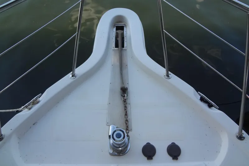 Slide: The Image of Bow of 2008 Bluewater 5200 Signature Edition yacht with anchor chain and railing. - 16