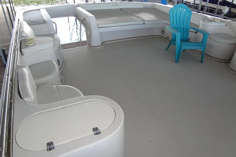 Slide: The Image of Spacious deck of 2008 Bluewater 5200 Signature Edition with seating and a blue chair. - 18