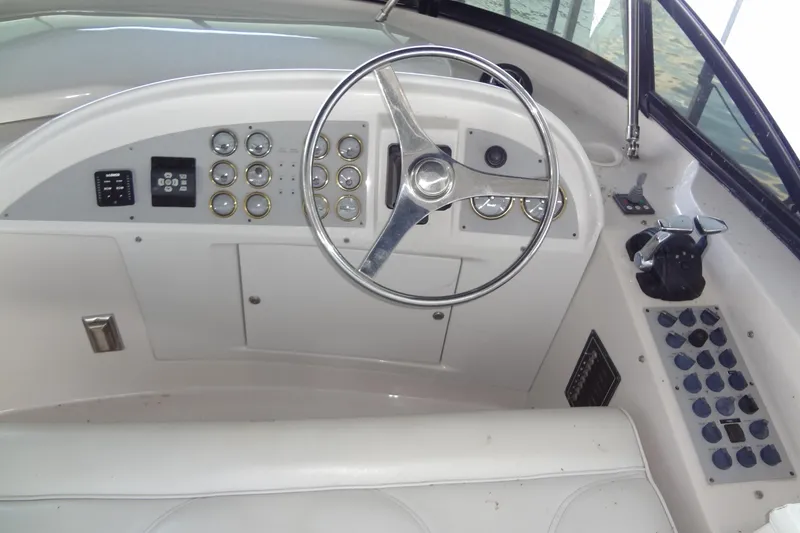 Slide: The Image of 2008 Bluewater 5200 Signature Edition helm with steering wheel and control panel. - 25