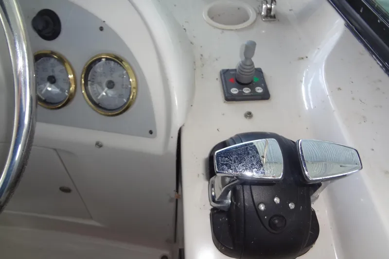 Slide: The Image of Control panel of a 2008 Bluewater 5200 Signature Edition boat with gauges and throttle. - 28