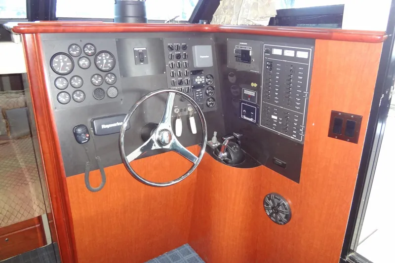 Slide: The Image of Control panel of 2008 Bluewater 5200 Signature Edition yacht with steering wheel and gauges. - 32