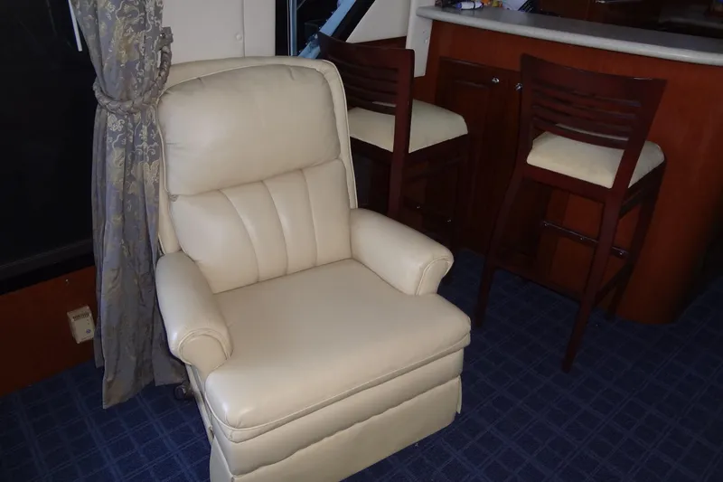 Slide: The Image of Luxurious interior of 2008 Bluewater 5200 Signature Edition yacht with leather chair and bar stools. - 36