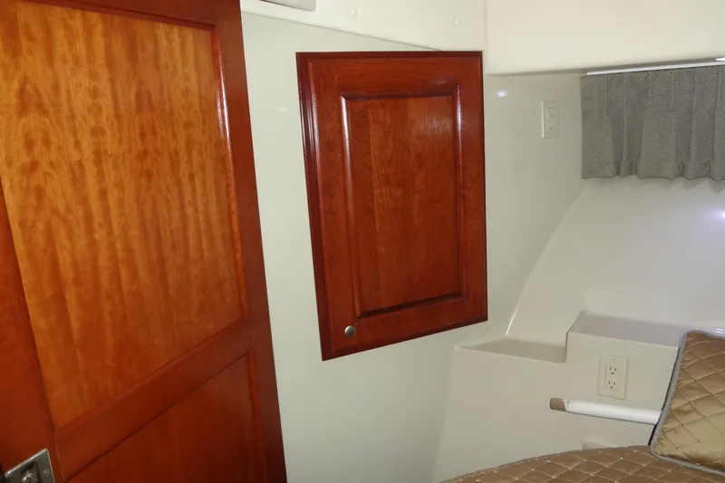 Slide: The Image of Interior cabin of 2008 Bluewater 5200 Signature Edition with wood paneling and bed. - 39