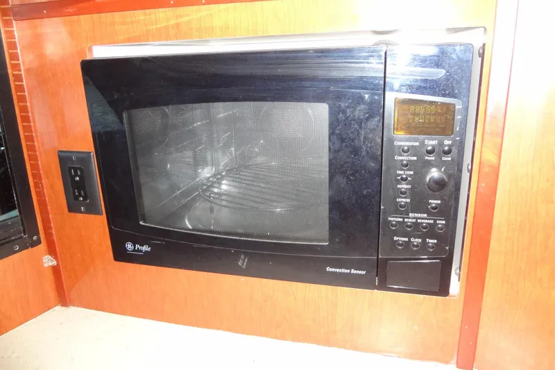 Slide: The Image of GE Profile microwave in 2008 Bluewater 5200 Signature Edition yacht kitchen. - 47