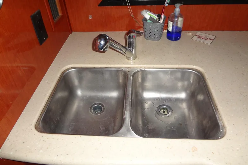 Slide: The Image of Double sink in 2008 Bluewater 5200 Signature Edition yacht kitchen area. - 48